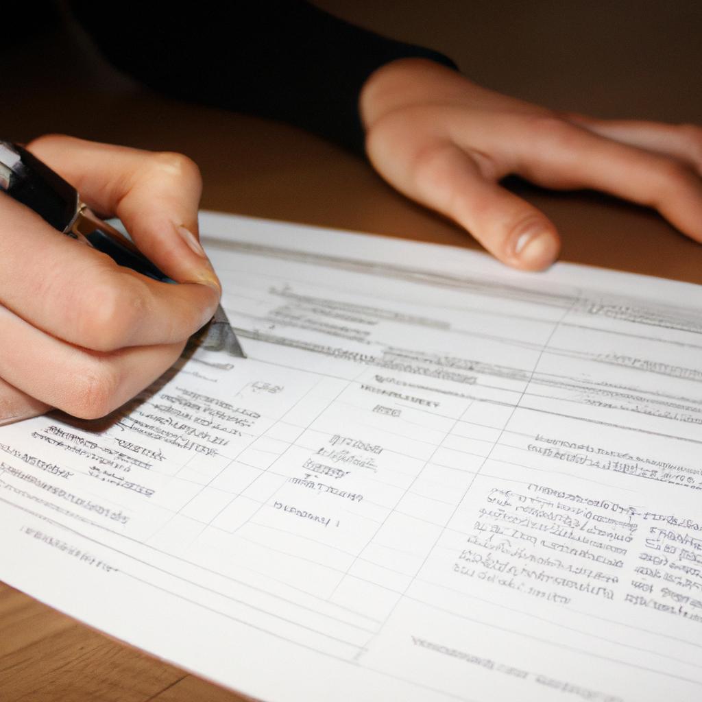 Person filling out financial forms