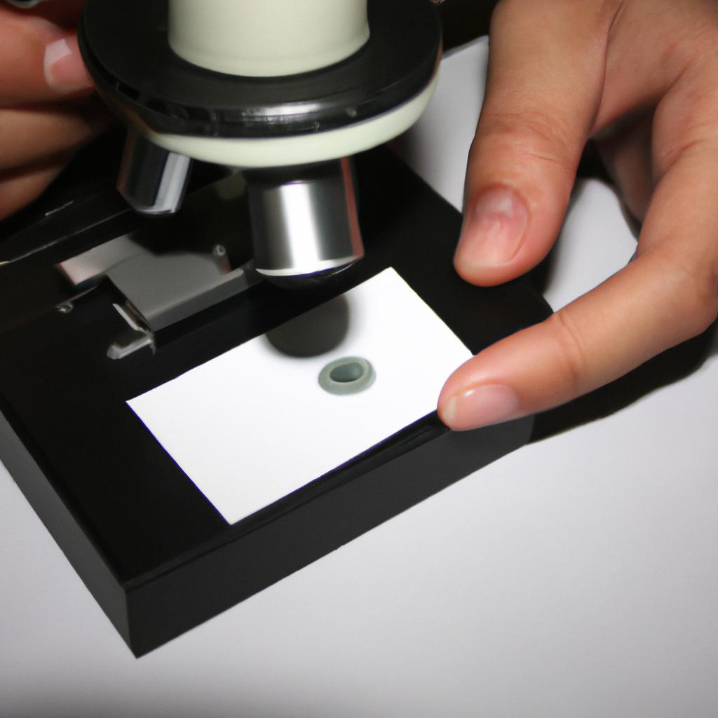 Person examining microscope slide samples